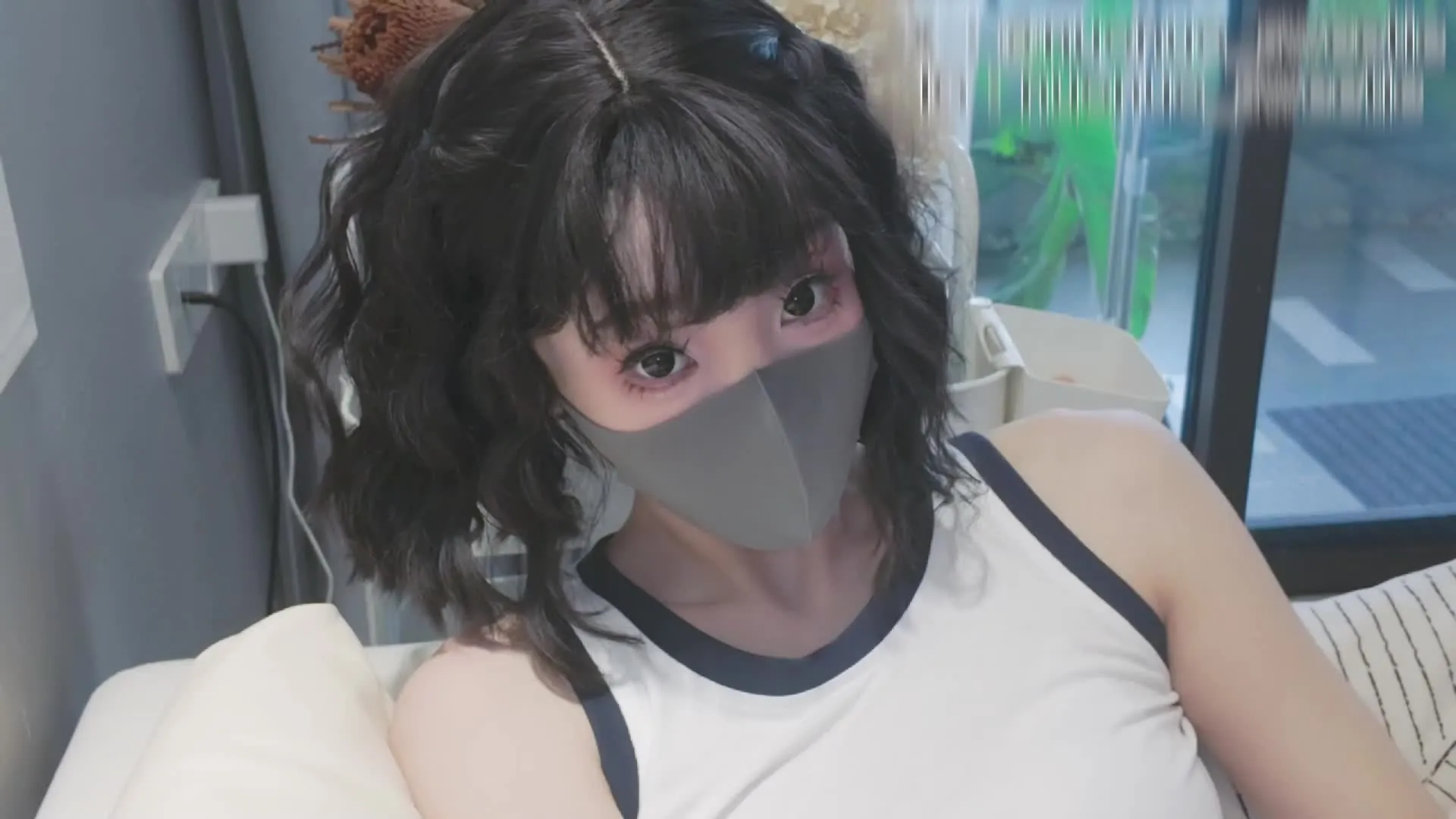 A young first-time shooter, a sister to the dolls on stage.